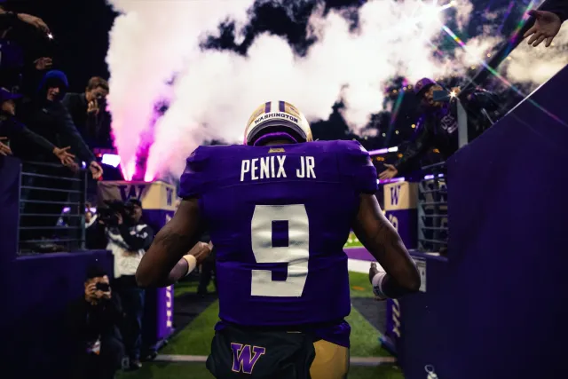 Penix Jr. taking the field through the tunnel